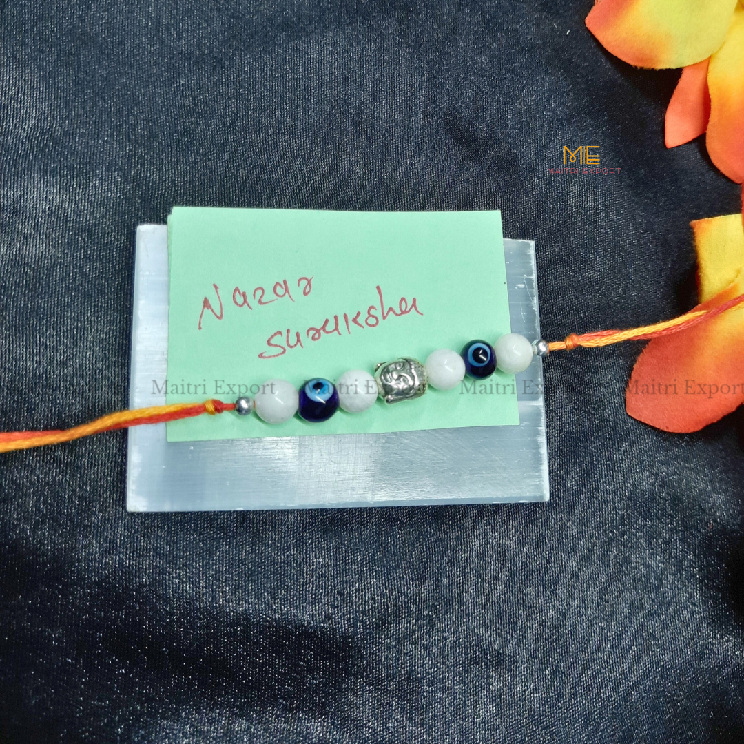 Natural crystal stone purposed rakhi-Nazar Suraksha-with buddha charm-Maitri Export | Crystals Store