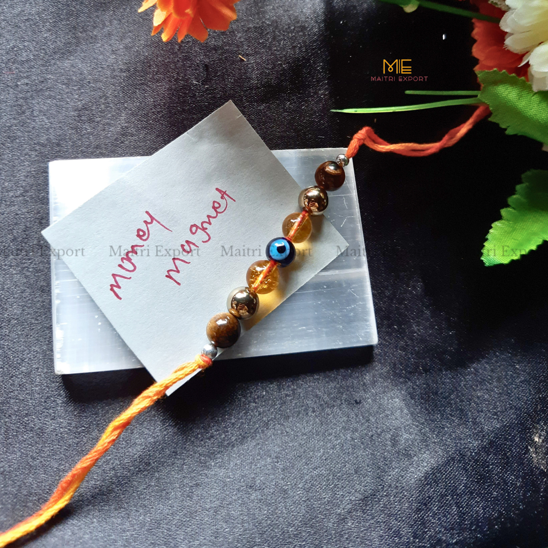 Natural crystal stone purposed rakhi-Money Megnet-with evil eye bead-Maitri Export | Crystals Store