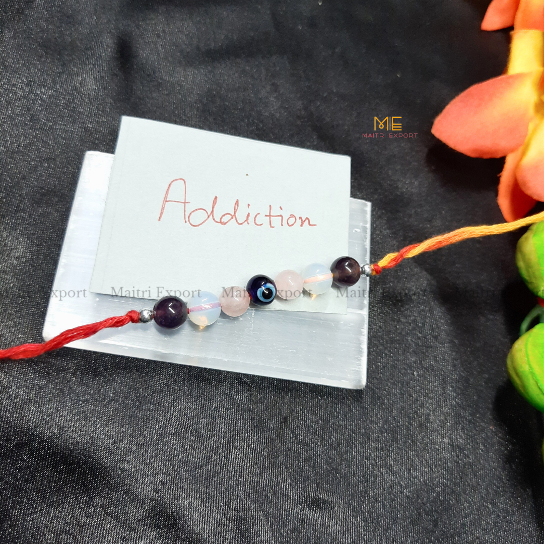 Natural crystal stone purposed rakhi-Addiction-with evil eye bead-Maitri Export | Crystals Store