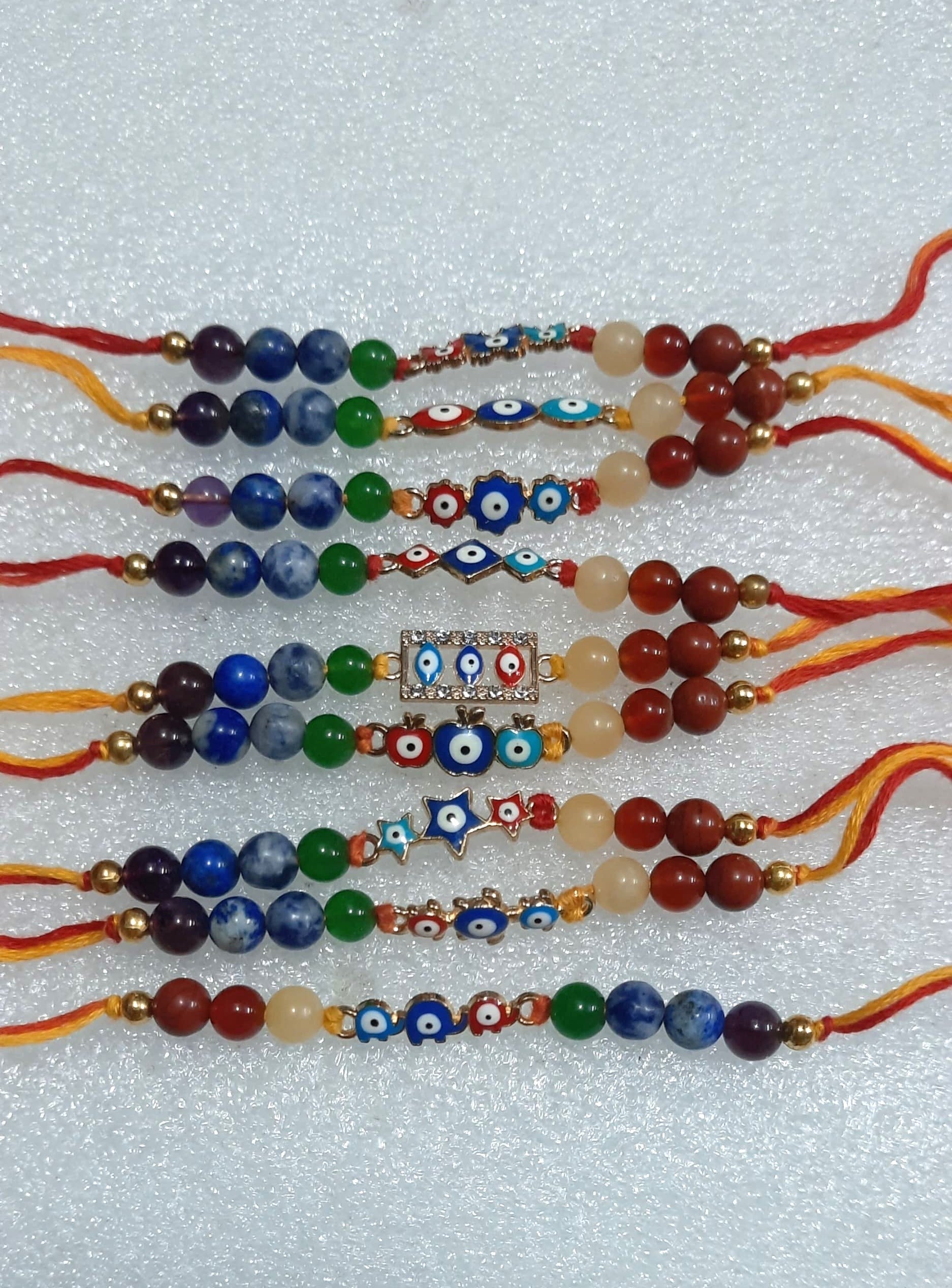 Triple evil eye rakhi with 7 chakra 6mm beads-Maitri Export | Crystals Store