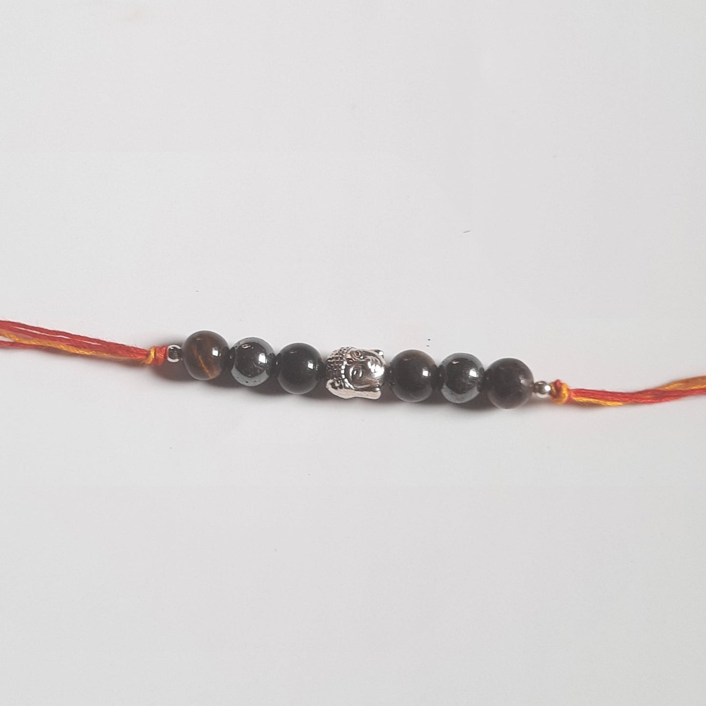 Triple protection rakhi-With buddha-Maitri Export | Crystals Store