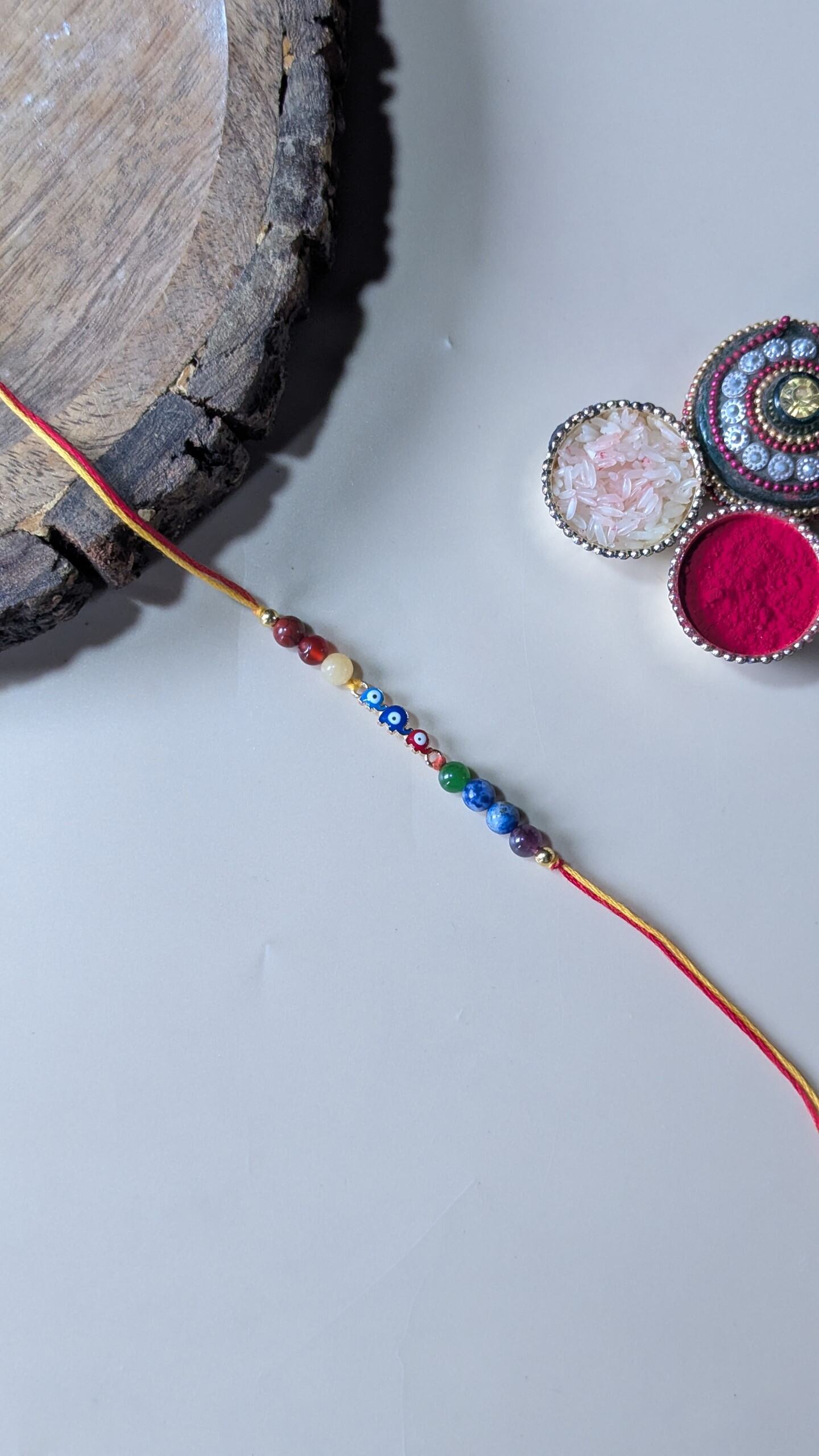 Triple evil eye rakhi with 7 chakra 6mm beads-elephant-Maitri Export | Crystals Store