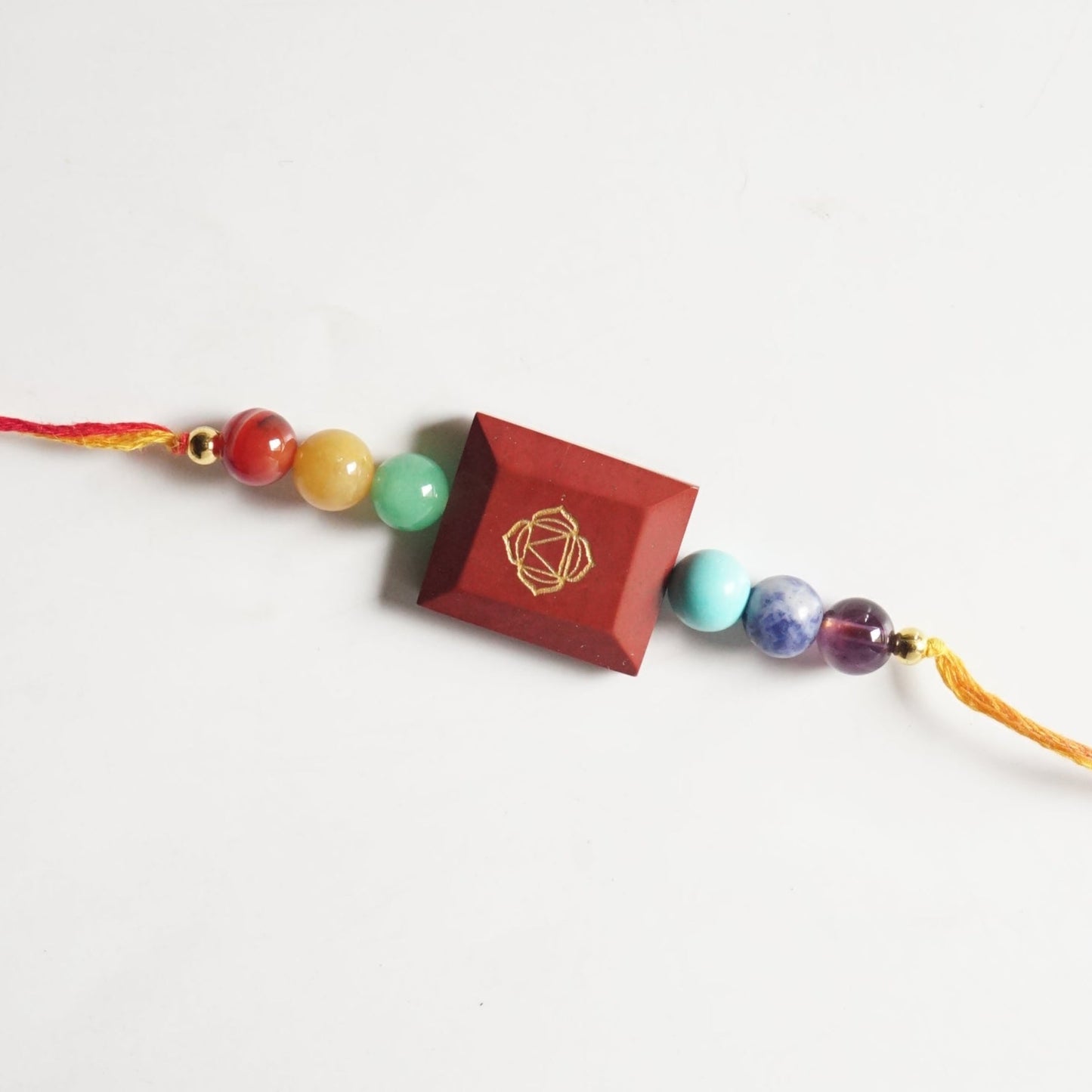 7 chakra with each chakra symbol rakhi-Red jasper-Maitri Export | Crystals Store