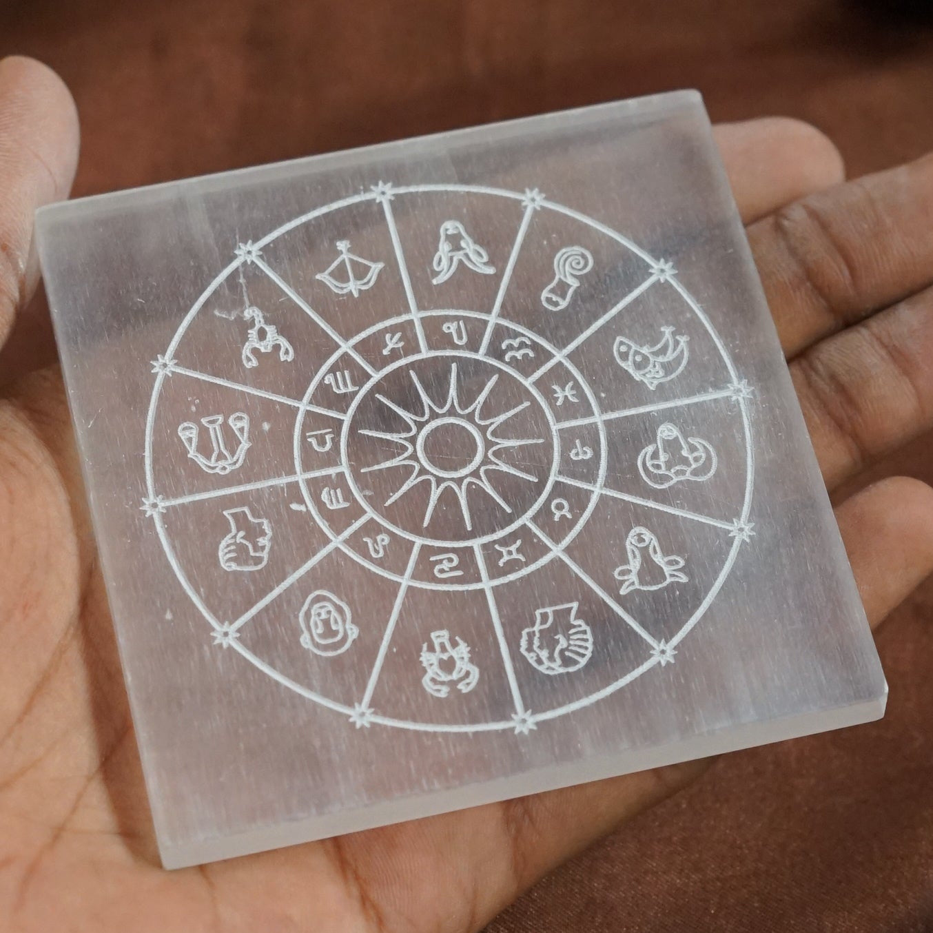 Natural selenite plate with different carvings 2 inch