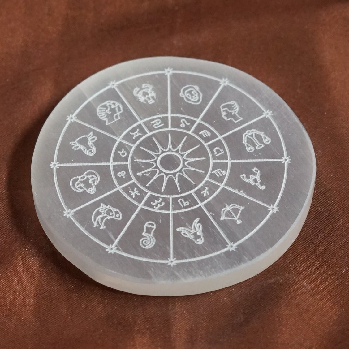 Natural selenite plate with different carvings-Round-Zodiac sign-Maitri Export | Crystals Store