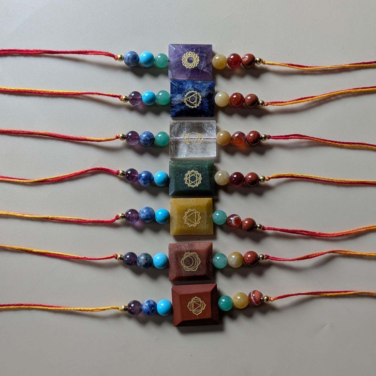 7 chakra with each chakra symbol rakhi-Whole set-Maitri Export | Crystals Store