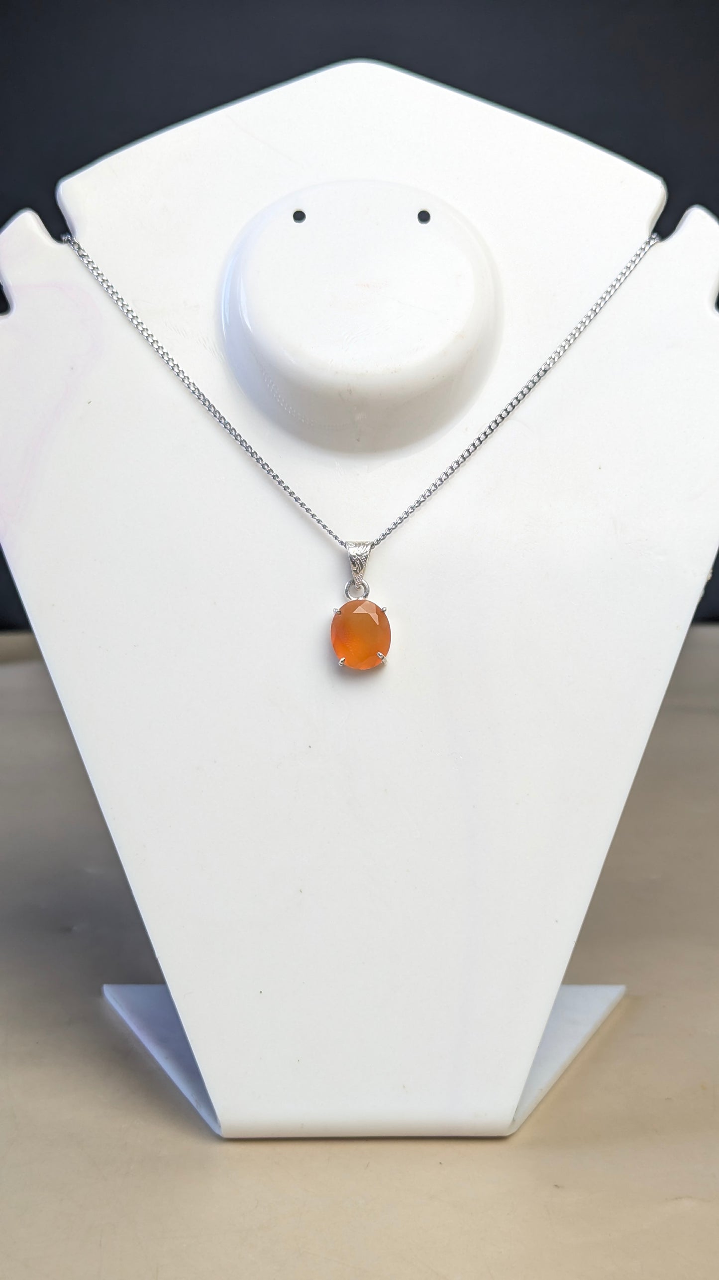 Gem quality anti tarnish Natural healing crystal Oval faceted pendant with rhodium polish-Carnelian-Maitri Export | Crystals Store