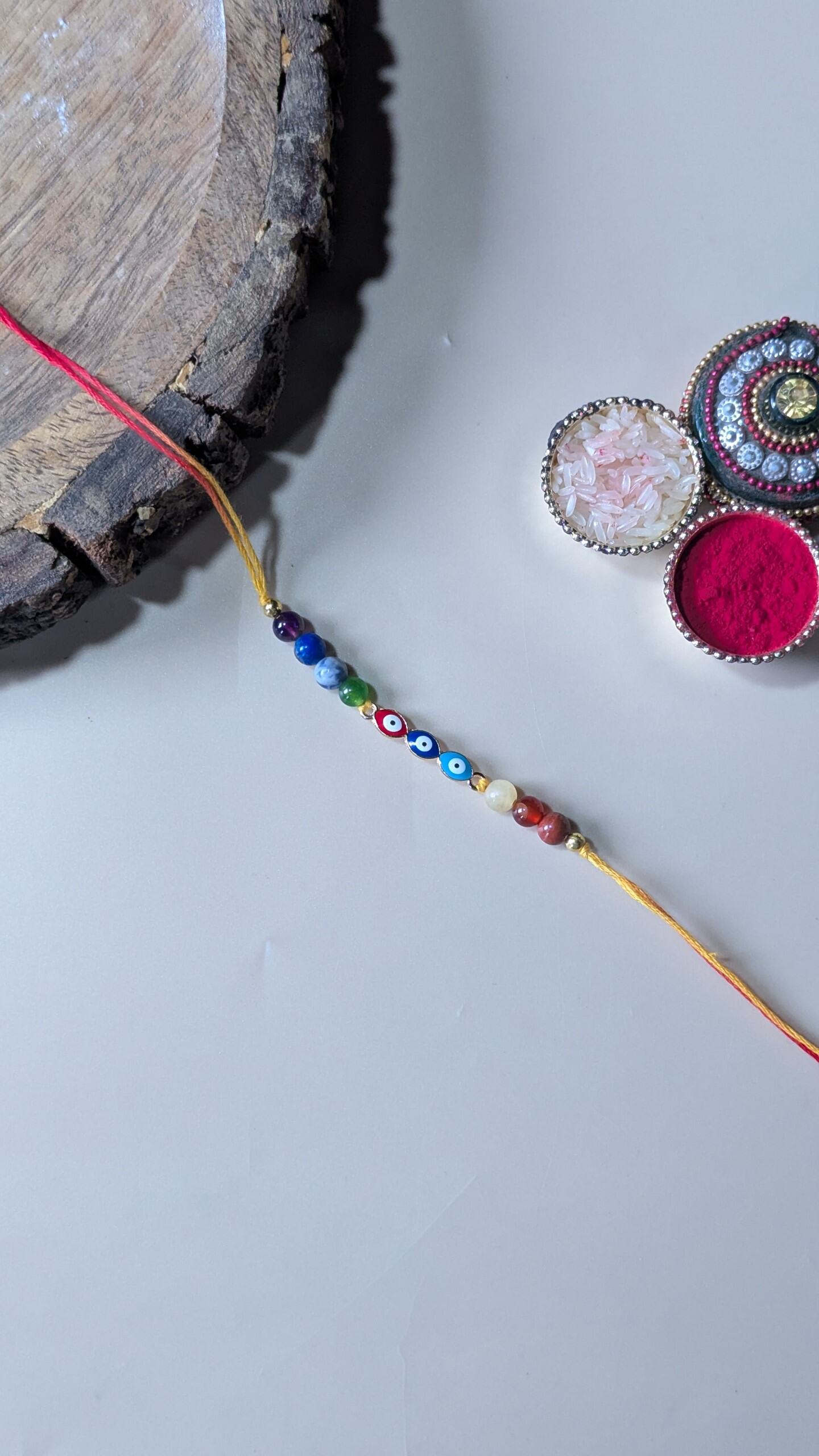 Triple evil eye rakhi with 7 chakra 6mm beads-Leaf-Maitri Export | Crystals Store
