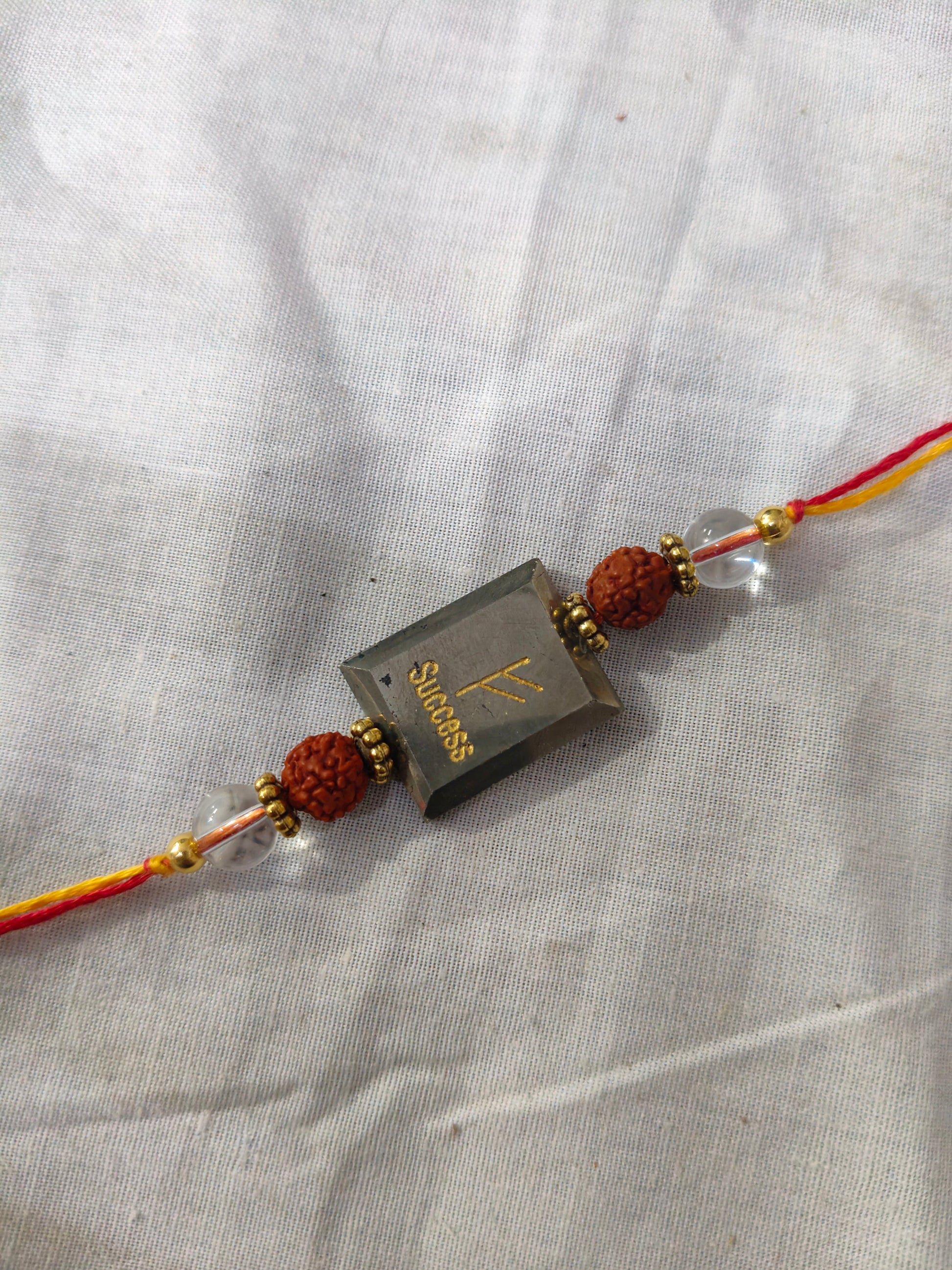 Pyrite centerpiece with rudraksh and clear quartz rakhi-Success-Maitri Export | Crystals Store