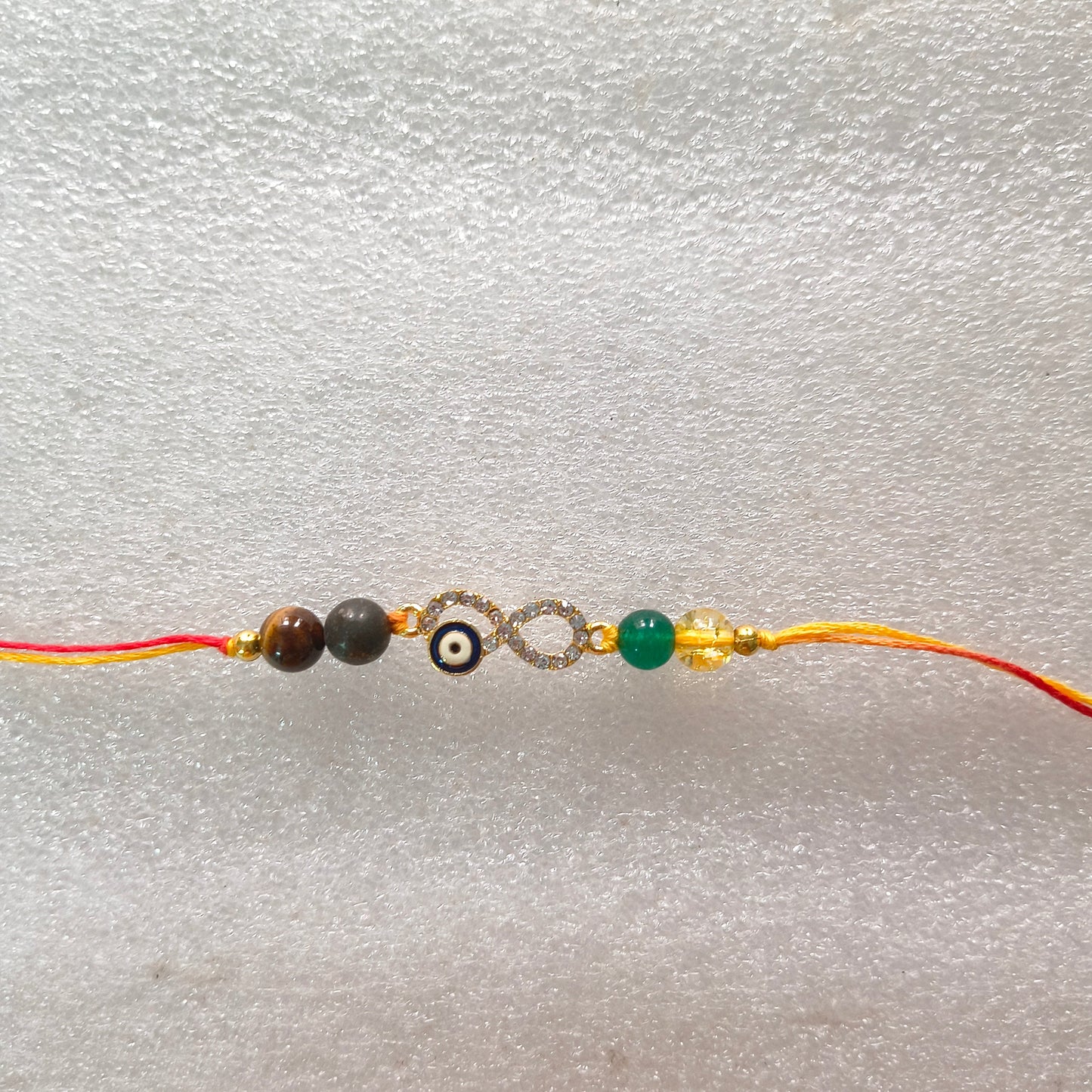 Rakhis with infinity ♾️ charm-Money magnet-Maitri Export | Crystals Store