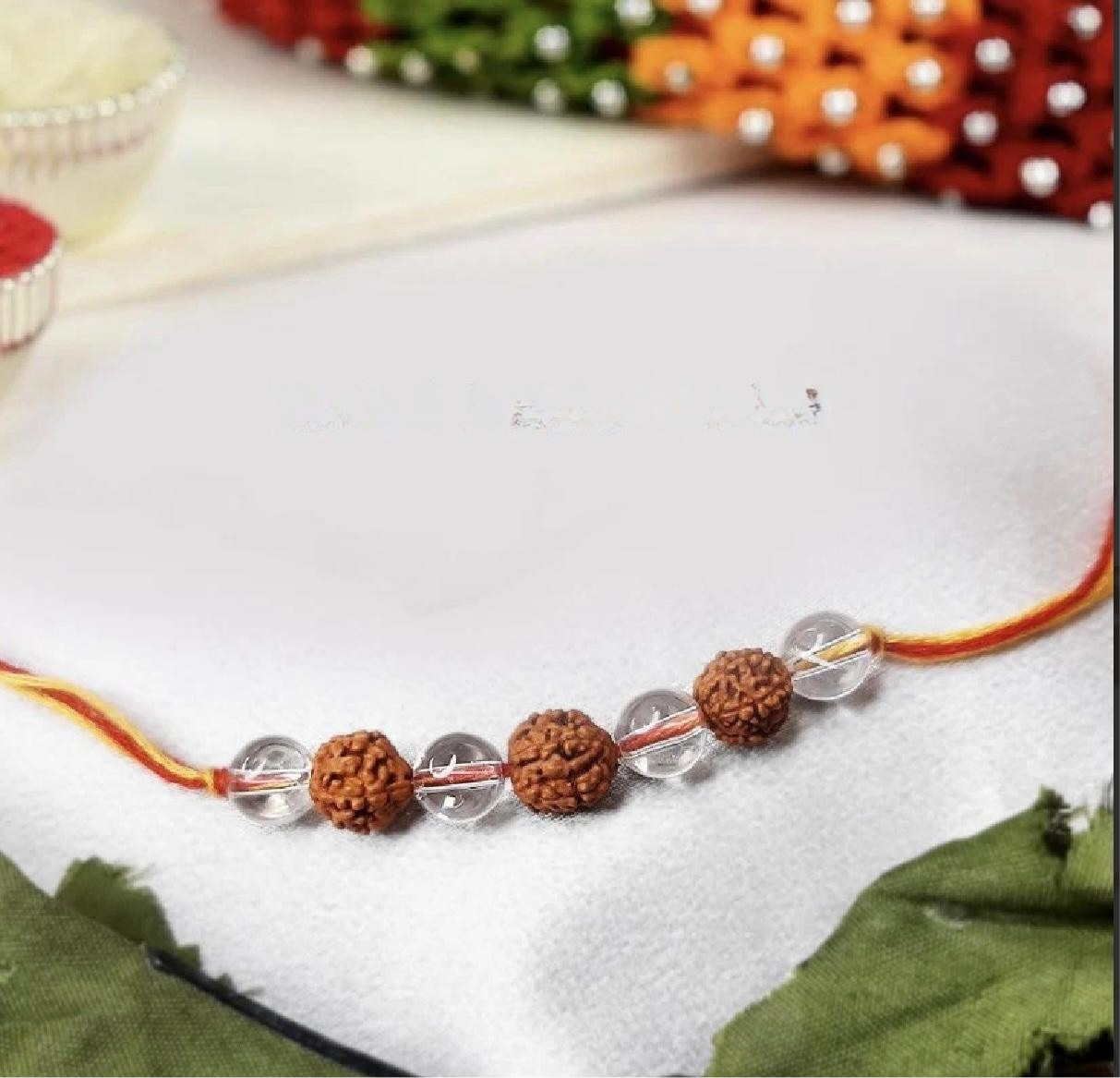 Rudraksh and clear quartz rakhi-Maitri Export | Crystals Store